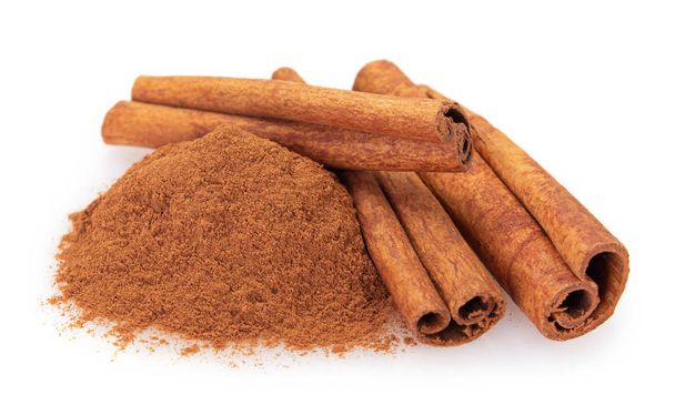 cinnamon stick with powder isolated on white background closeup - Photo, Image