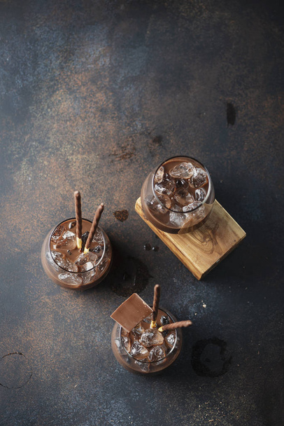 Creamy sweet liqueur with chocolate and ice, selective focus - Photo, image