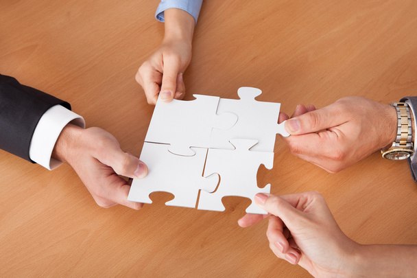 Businesspeople Holding Jigsaw Puzzle - Fotografie, Obrázek