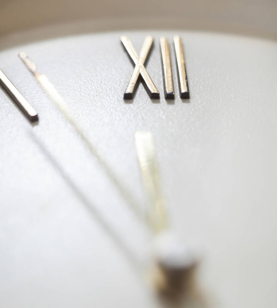 Clock face of the old wall clock. Roman numerals. Hour and minute hands. Time concept. Close-up. - Photo, Image