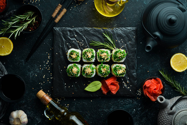 Sushi rolls - Kyoto with salmon, cucumber and Chuka salad. Sushi menu bar. Japanese food - Valokuva, kuva