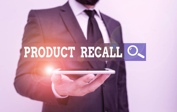 Conceptual hand writing showing Product Recall. Business photo showcasing process of retrieving potentially unsafe goods from consumers Male human wear formal work suit hold smartphone using hand. - Zdjęcie, obraz
