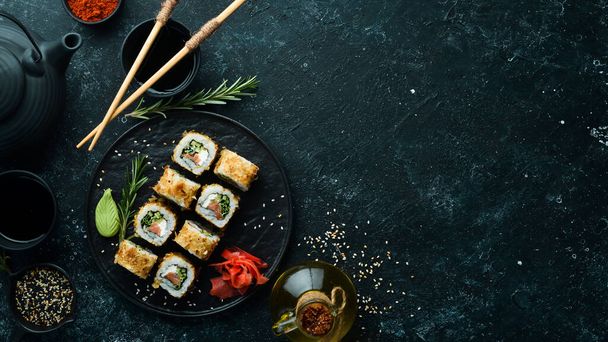 Sushi Bonito with salmon, cheese and tuna chips. Traditional Japanese sushi rolls - 写真・画像