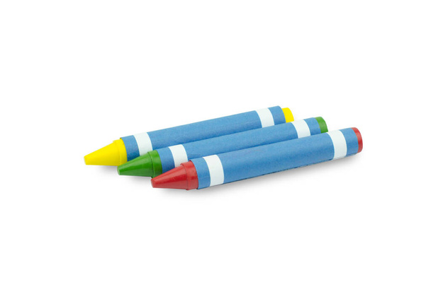 Красно-зеленый и желтый восковые карандаши на белом фоне
 - Фото, изображение