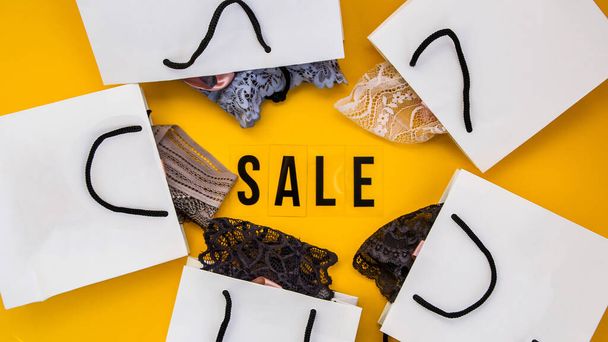 packaging bags, text Big sale on yellow background Top view Flat lay sesonal sale, retail, shopping concept, black friday concept - Photo, Image