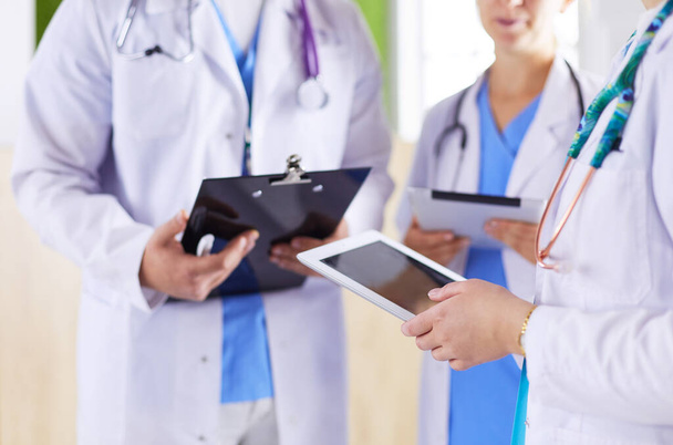 Doctors using a tablet in hospital standing in office - Fotografie, Obrázek