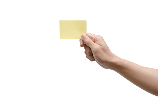 Hand houden geel papier geïsoleerd op wit met clipping pad - Foto, afbeelding