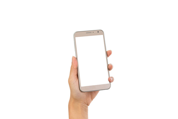 Ręka młoda kobieta trzyma smartfon z pustym ekranem odizolowany na białym tle z ścieżką wycinania - Zdjęcie, obraz