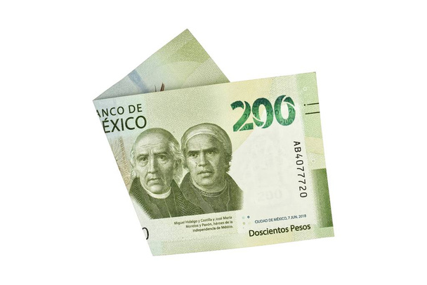 A single middle folded 200 mexican peso bill isolated and on white background - Photo, Image