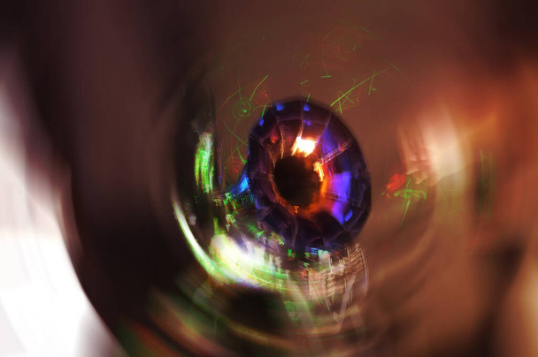 Close-up of inside of the horn of an old gramophone. Abstract image of an old, metallic musical object.  Radial blur effect - Photo, Image
