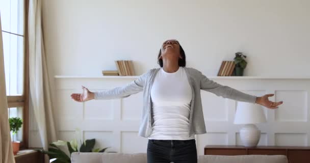 Excited homeowner spinning with stretched arms, real estate concept. - Filmagem, Vídeo