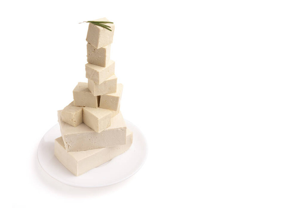Pieces of tofu cheese stacked in pyramid - Photo, Image