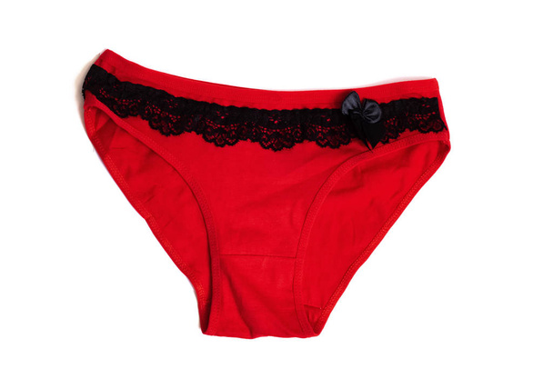 Red female underpants with black lace isolated on a white background - Photo, Image
