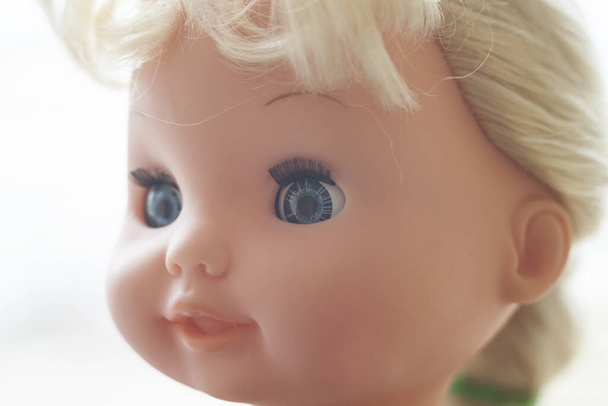 The face of the blonde doll. Close up. - Valokuva, kuva