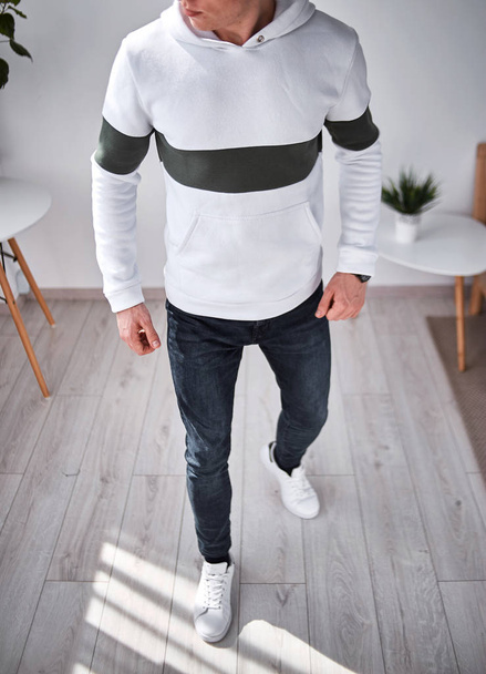 man in white hoodie with dark stripe - Photo, Image