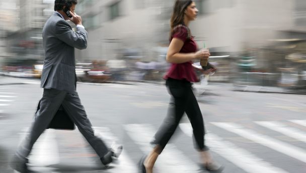 motion blurred business people walking on the street - Фото, изображение
