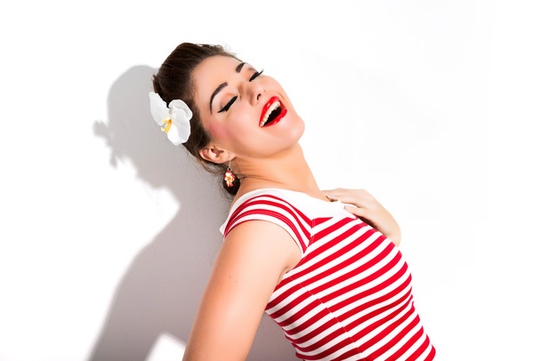 Sexy retro pin-up girl with red lipstick wearing red striped shi - Foto, Bild