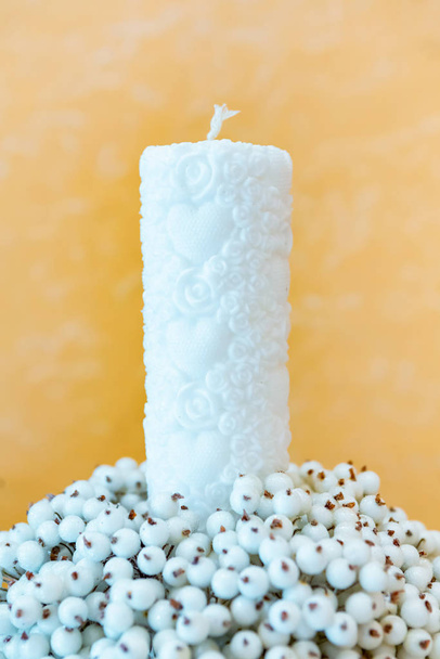 wedding decor. candle and artificial sugar berries. snow bush berries - Photo, Image