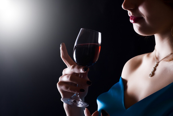 Beautiful woman with glass red wine - Фото, изображение