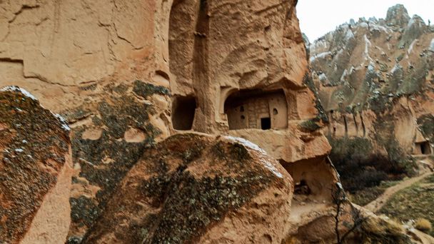 Cave houses and monasteries carved into Tufa Rocks at Zelve Open Air Museum (Zelve Valley) in winter season in Cappadocia, Turkey - Zdjęcie, obraz