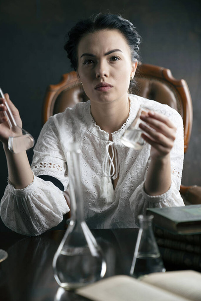Vintage chemist experimenting. Science research concept. - Photo, Image