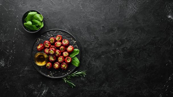 Pickled peppers stuffed with capers. Italian traditional dish. Top view. Free space for your text. - Fotografie, Obrázek