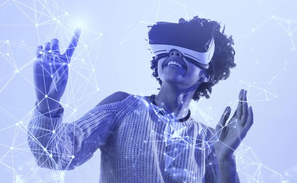 Happy African woman exploring virtual reality - Photo, Image