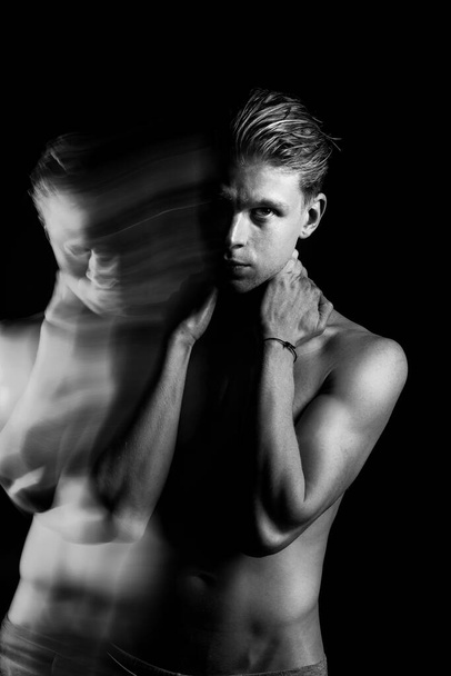 Dark man black and white portrait. looking intently Holding hands on neck Naked torso sporty body Creative original artistic series of photos Abstract metaphors of human anxiety, feelings and emotions - Photo, image