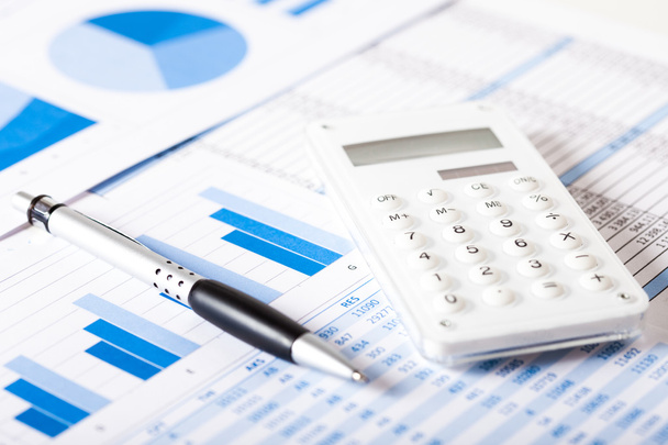 Calculator over financial documents - Foto, afbeelding