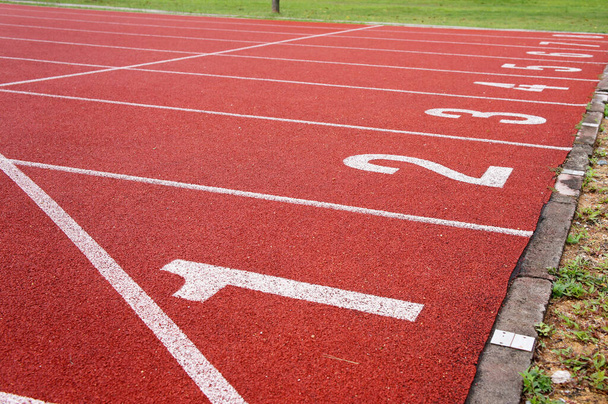 KUALA LUMPUR, MALAYSIA -APRIL 27, 2019: Outdoor running track or athlete track. Orange brick color.   - Zdjęcie, obraz