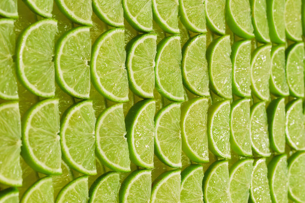 Fresh lime slices as a background.  - Photo, Image