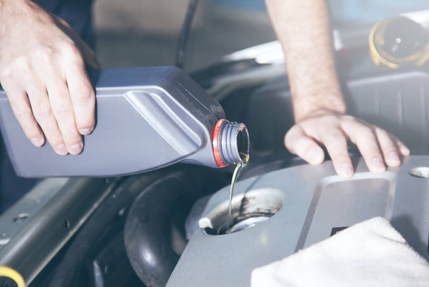 Man checking engine oil of an  car - Φωτογραφία, εικόνα