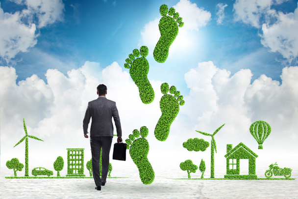 Carbon footprint concept met zakenman - Foto, afbeelding
