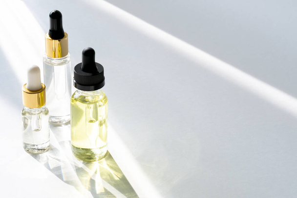 Anti aging serum with collagen and peptides in glass bottles with dropper  - Fotoğraf, Görsel