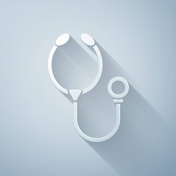 Řez papíru Stethoskop lékařské nástroje ikona izolované na šedém pozadí. Papírový styl. Vektorová ilustrace - Vektor, obrázek