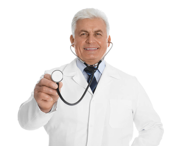 Senior doctor with stethoscope on white background - Фото, зображення