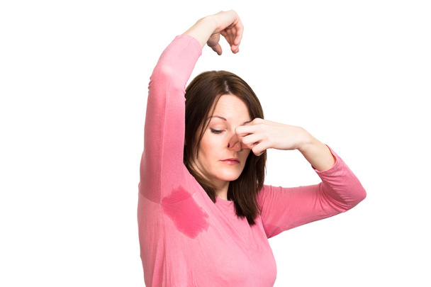 Femme transpirant très mal sous l'aisselle
 - Photo, image