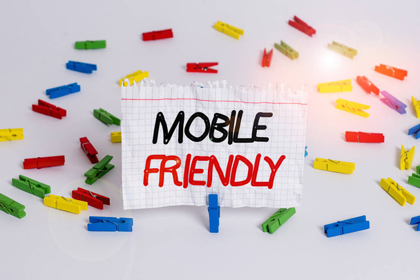 Conceptual hand writing showing Mobile Friendly. Business photo showcasing website is designed to display on a mobile device correctly Colored clothespin papers empty reminder white floor office. - Fotografie, Obrázek