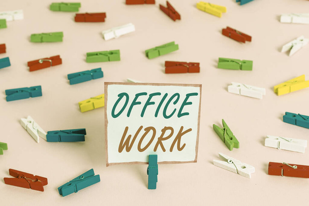 Conceptual hand writing showing Office Work. Business photo showcasing any clerical or administrative work for an organization Colored clothespin papers empty reminder pink floor office. - Foto, Bild