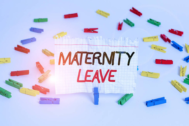 Conceptual hand writing showing Maternity Leave. Business photo showcasing the leave of absence for an expectant or new mother Colored clothespin papers empty reminder white floor office. - Photo, Image