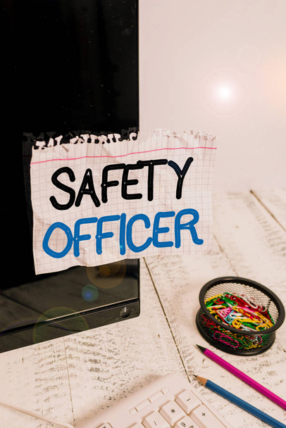 Word writing text Safety Officer. Business concept for a demonstrating responsible for ensuring safety regulations Note paper taped to black computer screen near keyboard and stationary. - Fotó, kép