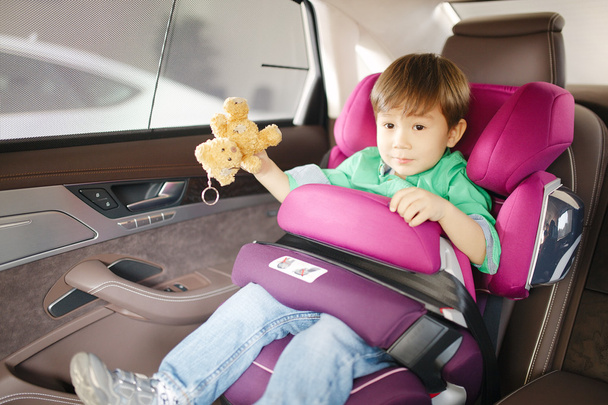 Luxury baby car seat for safety with happy kid - Foto, imagen