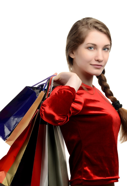 Young woman carrying many shopping bags. - Foto, imagen