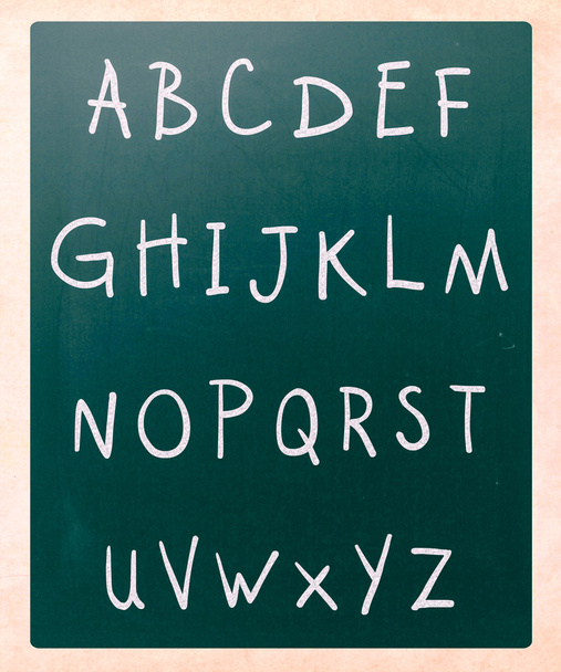 Complete english alphabet handwritten with white chalk on a blac - Foto, afbeelding
