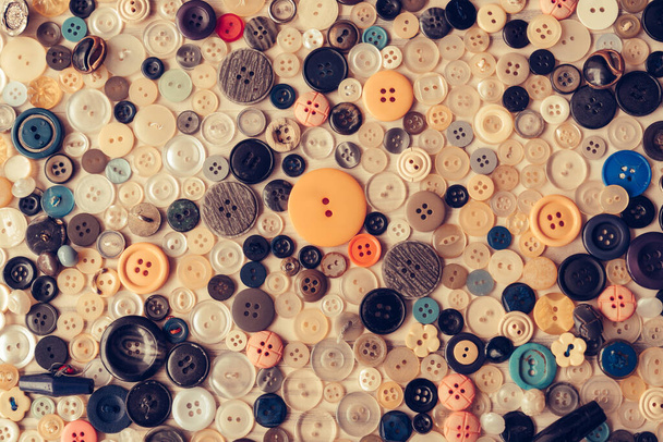 Sewing buttons of different size amd colors on isolated background. - Foto, imagen