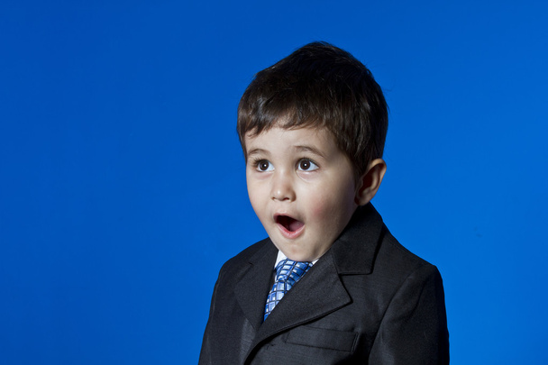 Businessman, cute little boy portrait over blue chroma backgroun - Фото, зображення