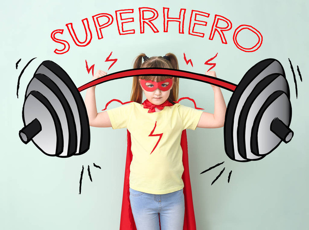 Petit super héros fort avec haltère dessinée sur fond de couleur
 - Photo, image