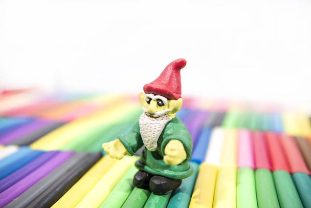 Play clay Animals. Gnome on colored background. - Photo, Image