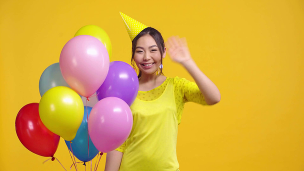 kazakh girl congratulating with happy birthday isolated on yellow  - Footage, Video
