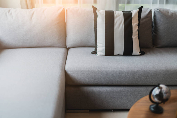soft cozy pollows on modern sofa with wooden background home design concept - Fotoğraf, Görsel